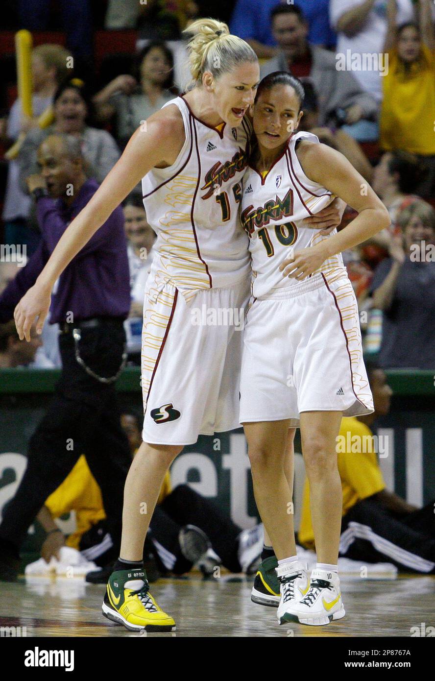 Seattle Storm's Lauren Jackson, left, grabs Sue Bird after Bird