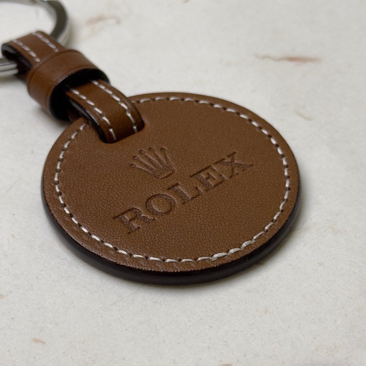 Rolex Brown Leather Keychain - the iconic Rolex logo embossed